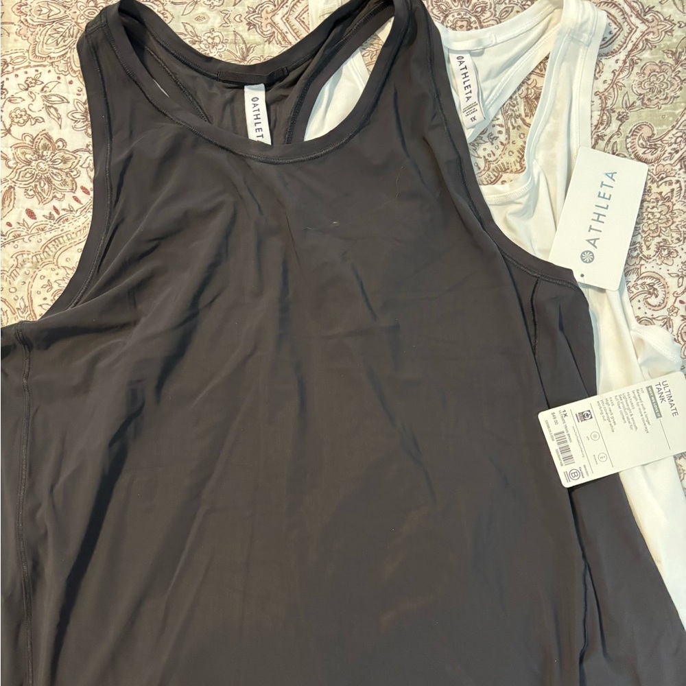 Two Athleta Women's Racerback Tank Tops - one black and one white - Size 1X